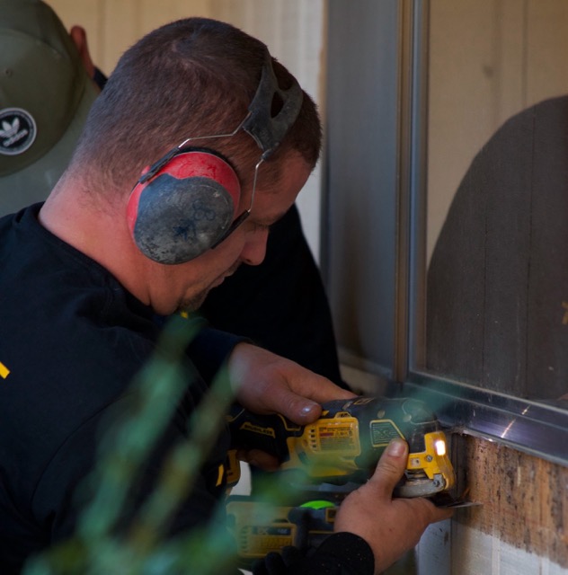 Construction technician working on an exterior wall